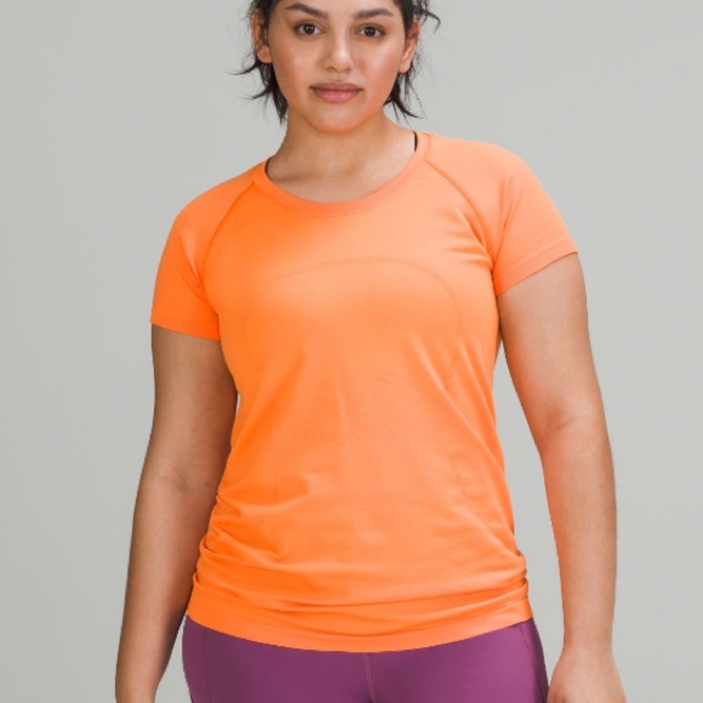 Lululemon Orange swiftly text short sleeve Top